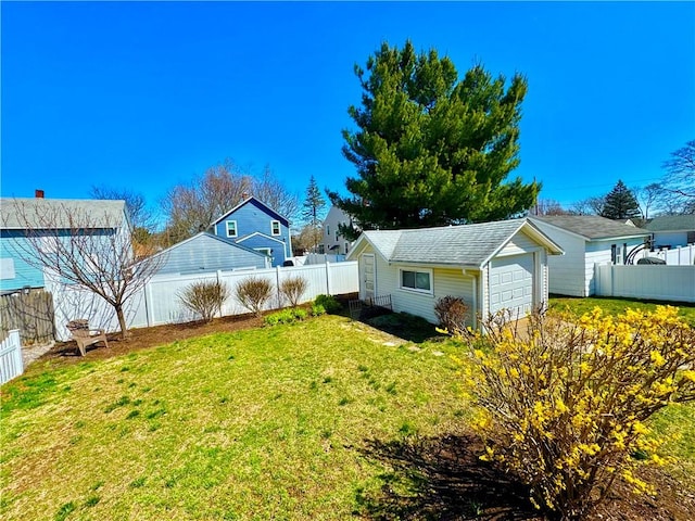 view of yard featuring an outbuilding and a fenced backyard