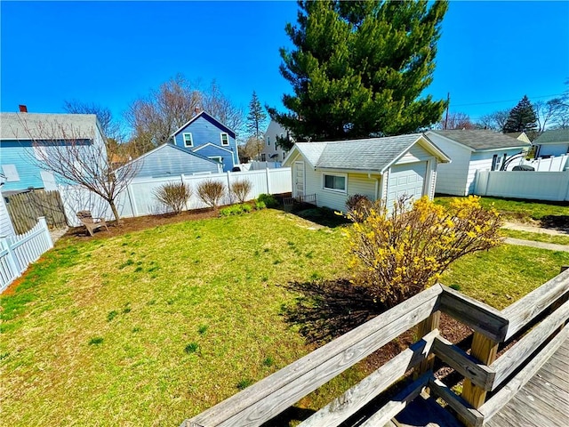 view of yard featuring an outdoor structure and a fenced backyard