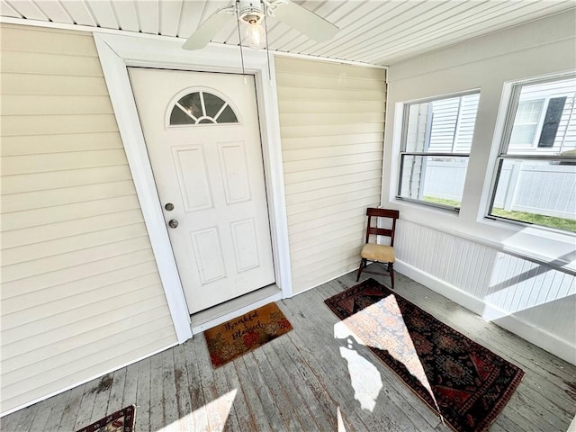 doorway to property featuring ceiling fan