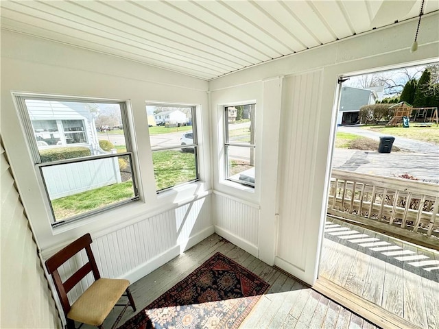 sunroom / solarium featuring a healthy amount of sunlight