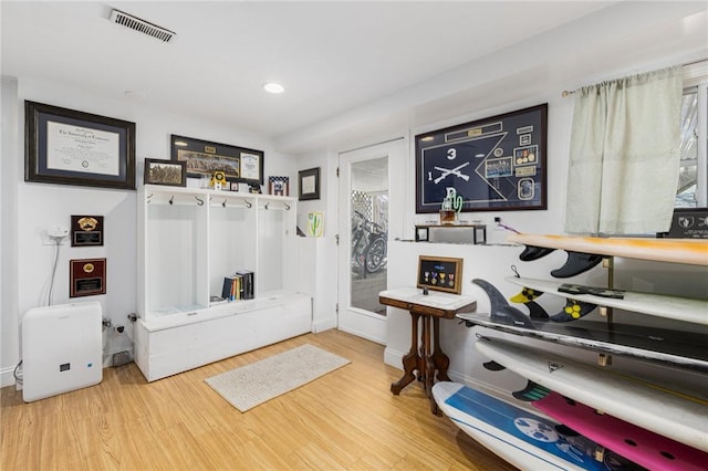 mudroom featuring recessed lighting, wood finished floors, visible vents, and a healthy amount of sunlight