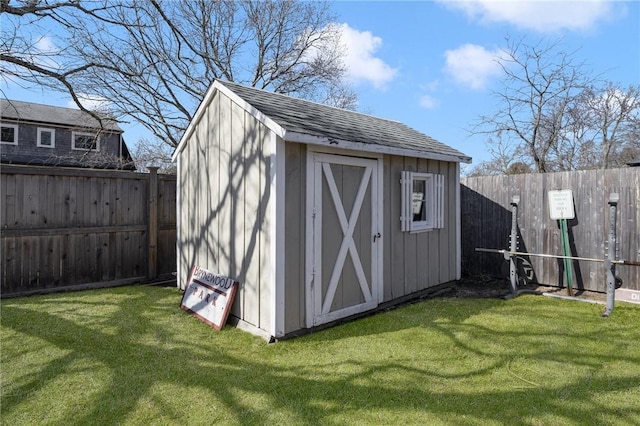 view of shed with a fenced backyard