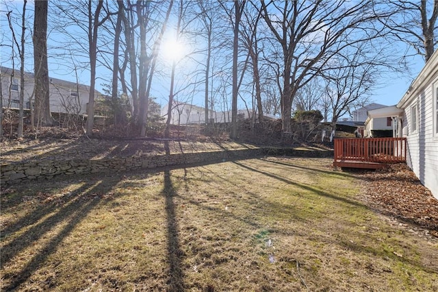 view of yard with a wooden deck