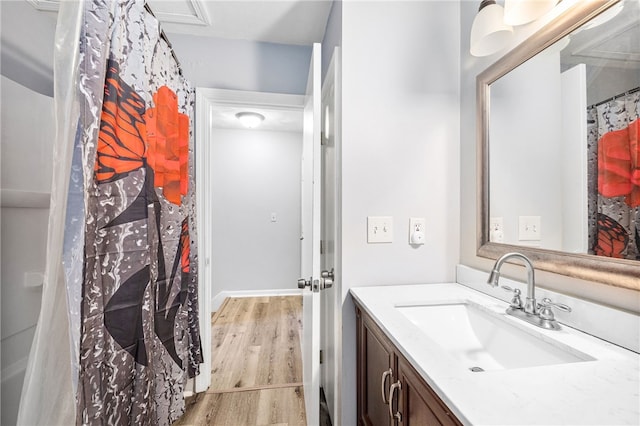 full bath featuring vanity and wood finished floors