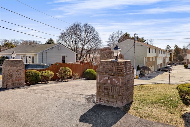 view of property exterior featuring fence