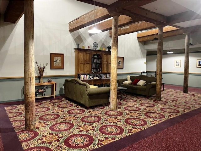 living area with beam ceiling