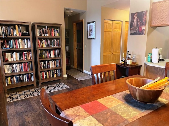 living area featuring wood finished floors and baseboards