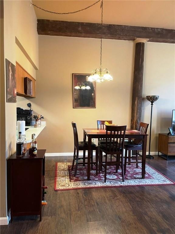 dining room with beamed ceiling, baseboards, a notable chandelier, and wood finished floors