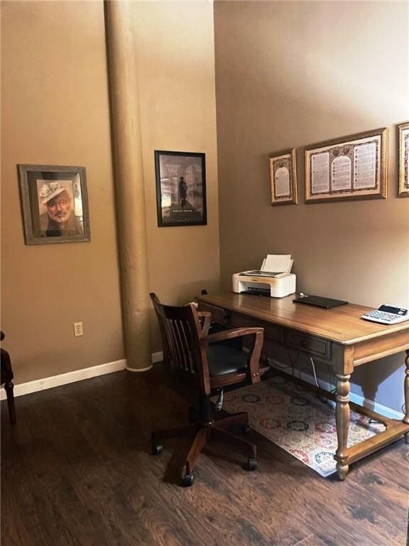 home office featuring baseboards and wood finished floors