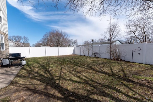 view of yard with a fenced backyard