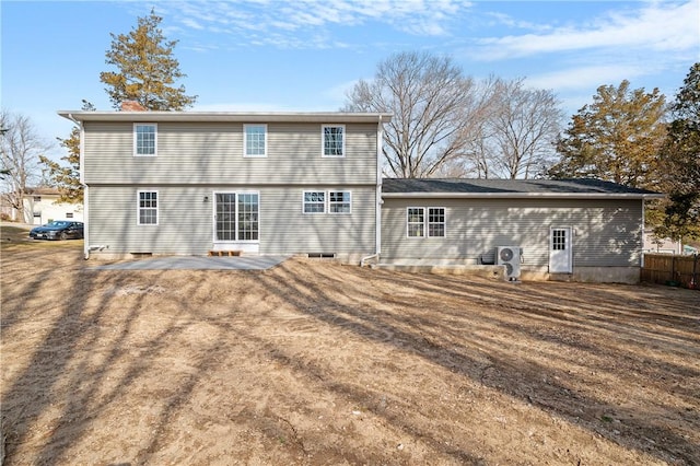 rear view of house with a patio and fence