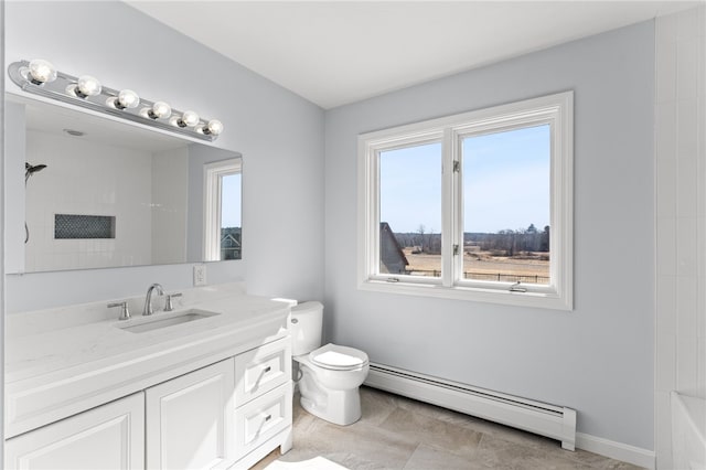 bathroom with toilet, baseboards, baseboard heating, walk in shower, and vanity