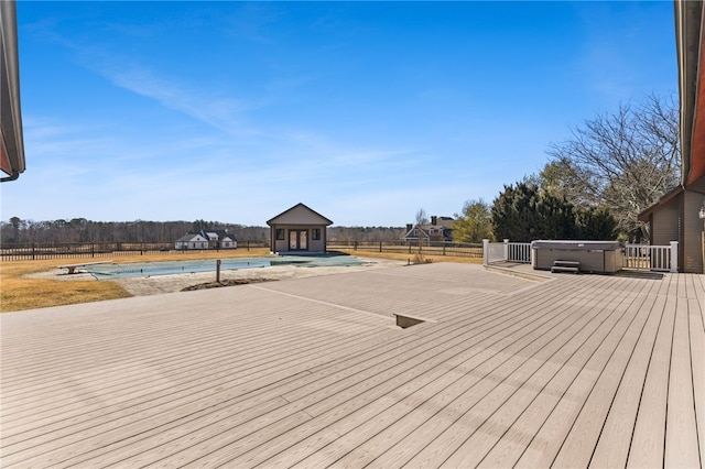 wooden deck featuring a fenced in pool, fence, an outdoor structure, and a hot tub