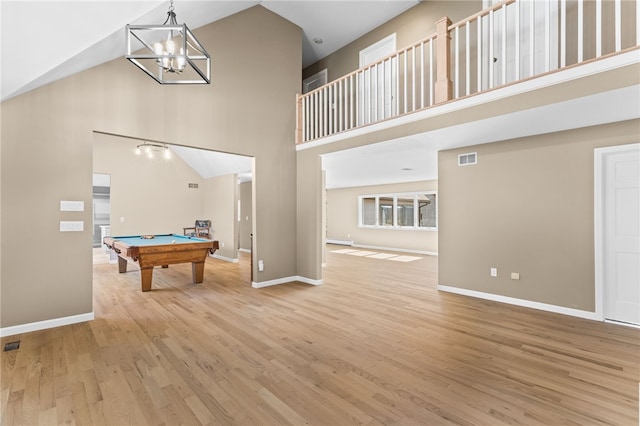 playroom with wood finished floors, visible vents, baseboards, a high ceiling, and pool table