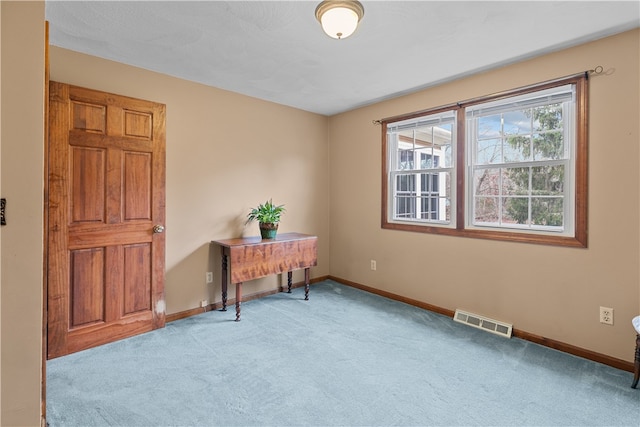 office featuring visible vents, baseboards, and carpet