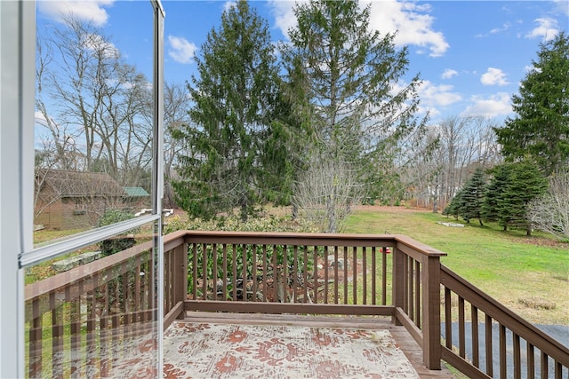 wooden deck with a lawn