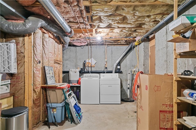 unfinished below grade area with washer and clothes dryer