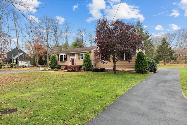 single story home featuring a front yard