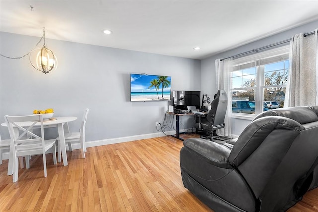 living room with recessed lighting, light wood-style flooring, and baseboards