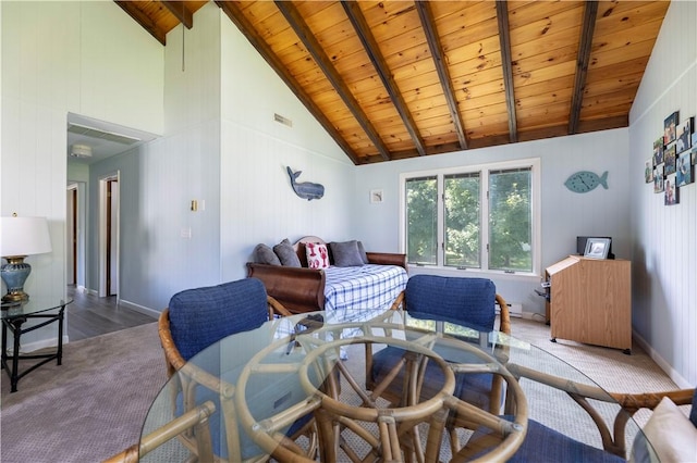 carpeted bedroom featuring visible vents, baseboards, beamed ceiling, wooden ceiling, and high vaulted ceiling