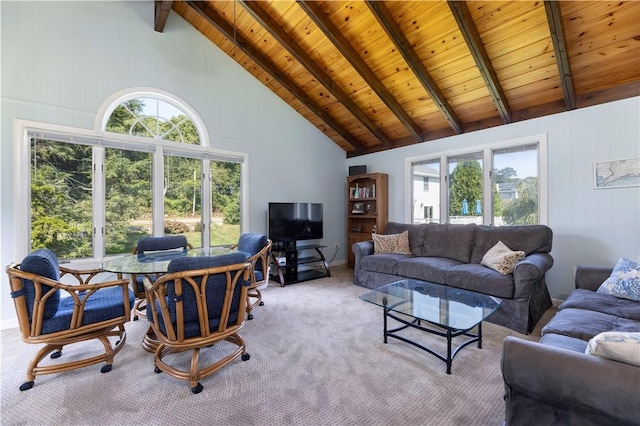 living area with beamed ceiling, wooden ceiling, high vaulted ceiling, and carpet