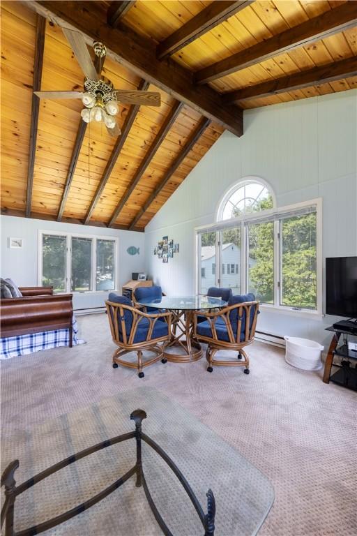 workout area featuring a baseboard heating unit, carpet floors, and wooden ceiling