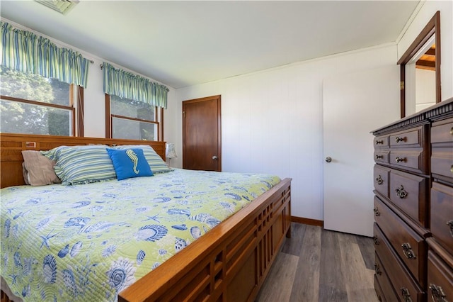 bedroom with wood finished floors and visible vents