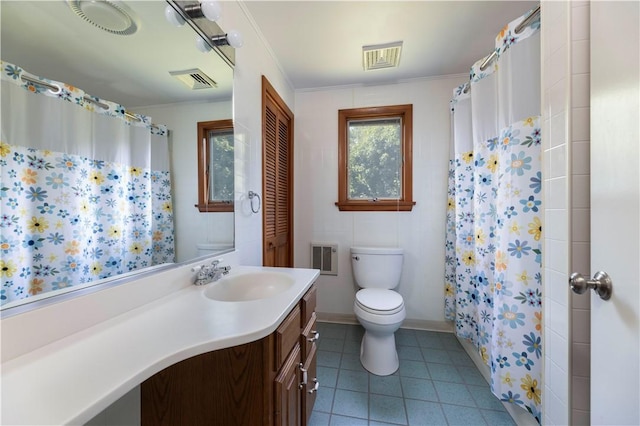 bathroom featuring vanity, tile patterned floors, toilet, and visible vents