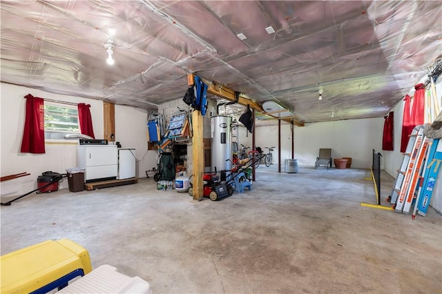 garage with washer and dryer and water heater