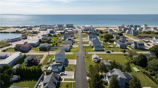 birds eye view of property with a residential view and a water view