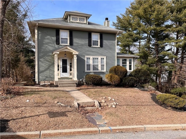 view of front of property with a chimney