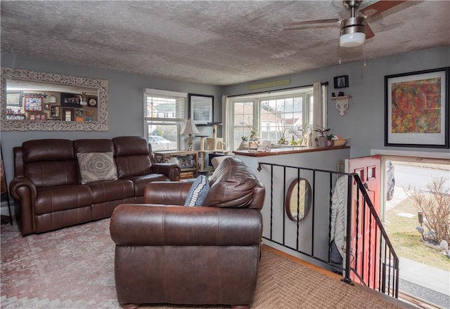 living room featuring baseboard heating and a textured ceiling