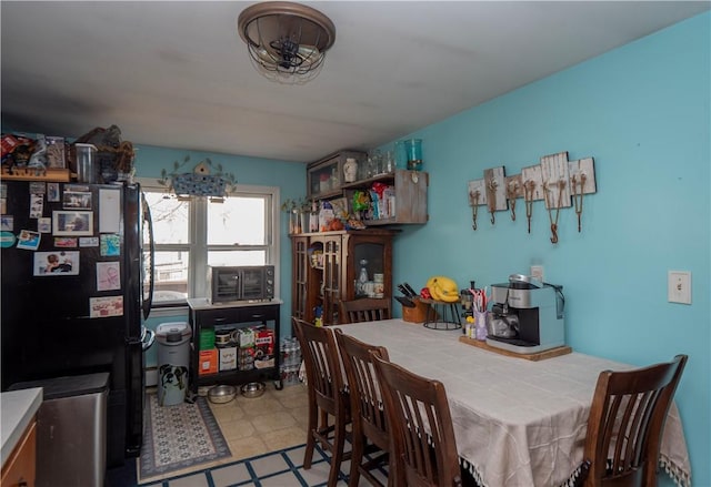 dining space with tile patterned floors