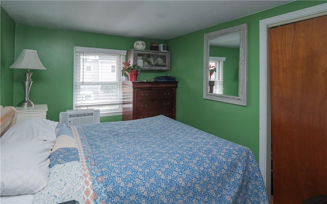 bedroom with a wall unit AC