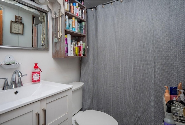 full bath with toilet and vanity