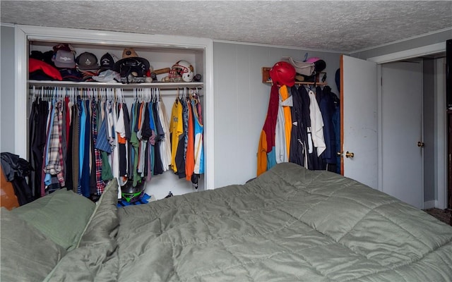 bedroom with a closet and a textured ceiling