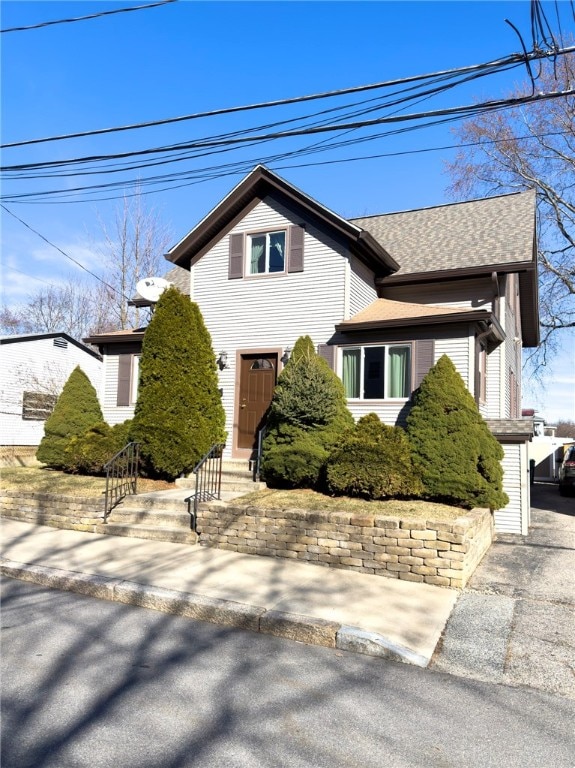 view of front of house featuring a shingled roof