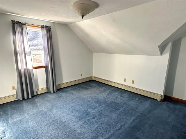 bonus room with lofted ceiling, carpet flooring, and baseboards