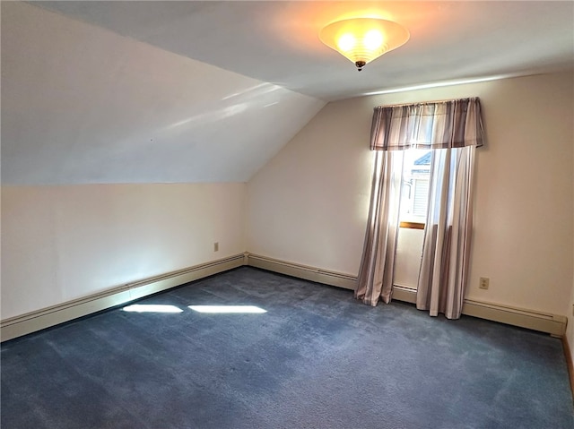 additional living space with vaulted ceiling and dark colored carpet