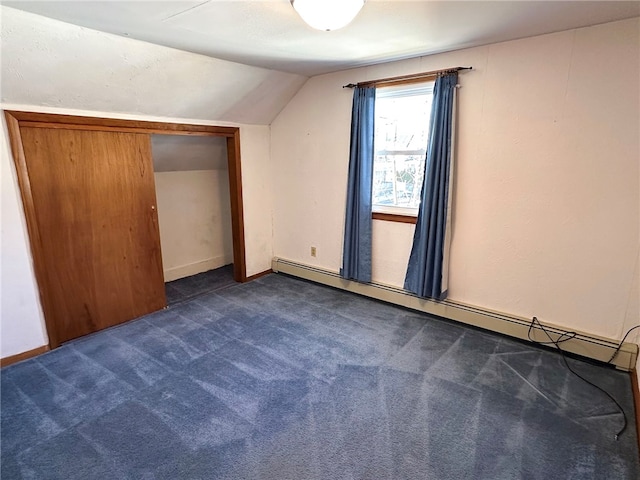 bonus room featuring dark colored carpet, baseboards, baseboard heating, and vaulted ceiling