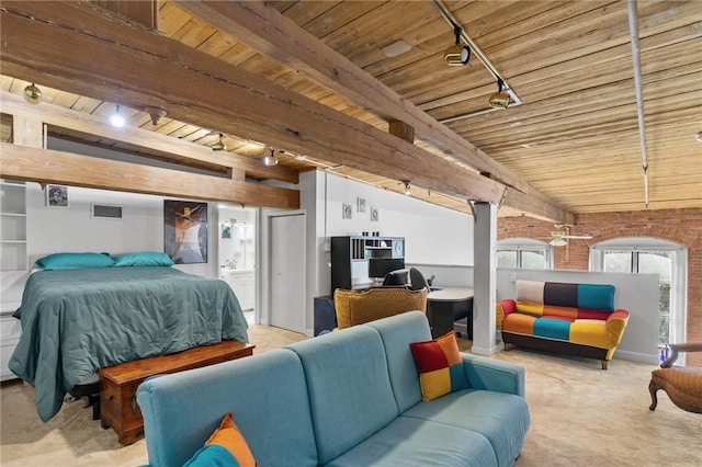 bedroom featuring visible vents, track lighting, brick wall, light colored carpet, and wood ceiling