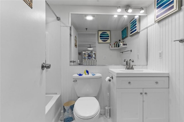 full bathroom featuring vanity, toilet, and washtub / shower combination