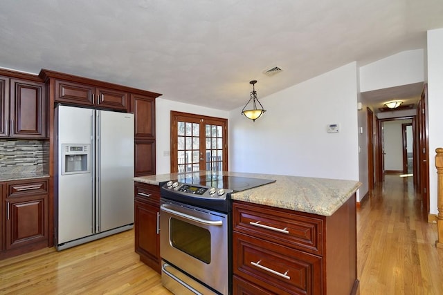 kitchen with visible vents, light wood-type flooring, french doors, white refrigerator with ice dispenser, and electric range