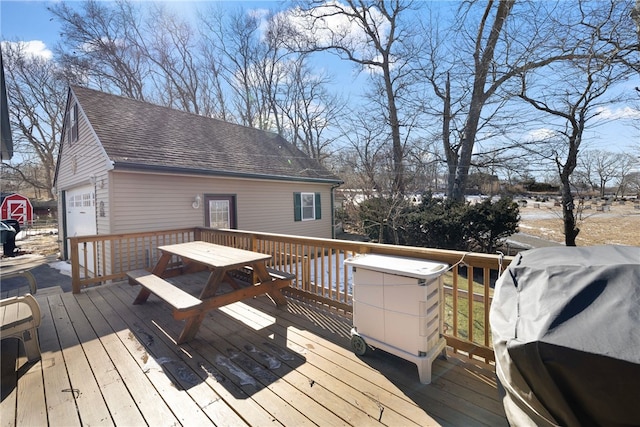 deck featuring an outdoor structure and grilling area