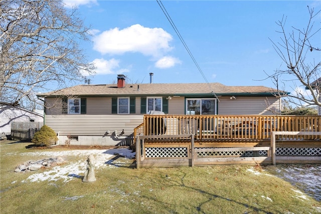 rear view of house with crawl space, a chimney, and a wooden deck