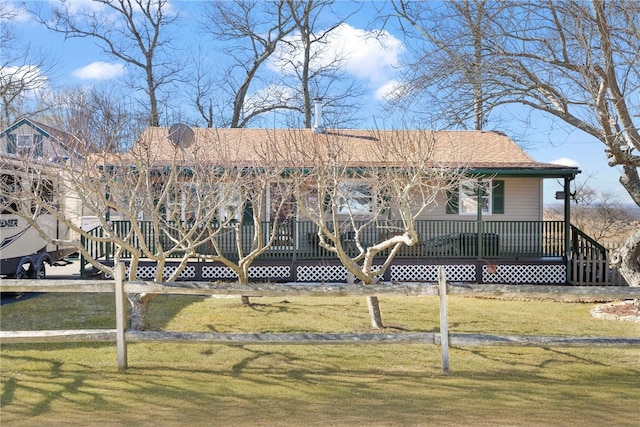 view of front of house featuring a front yard and a porch