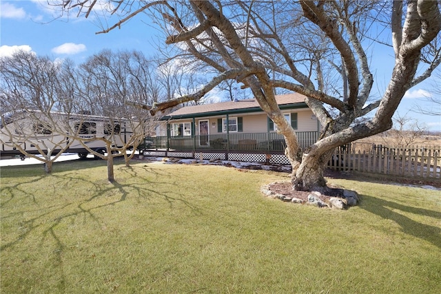 view of front facade with a front yard and fence