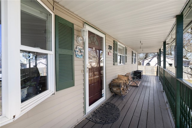 wooden terrace with a porch