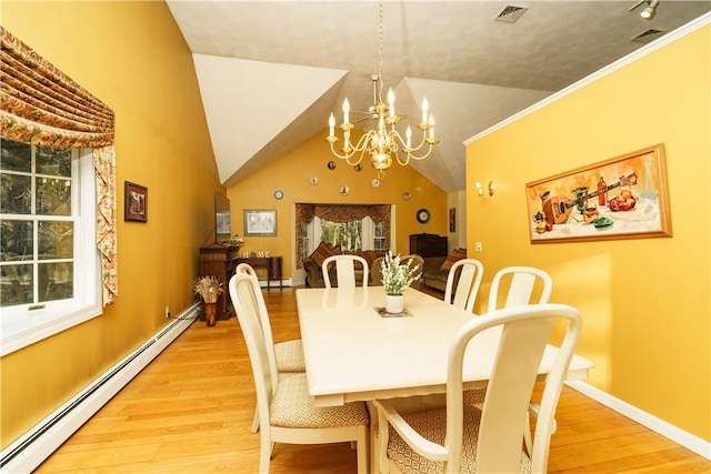 dining space with visible vents, light wood-style floors, an inviting chandelier, a baseboard radiator, and lofted ceiling