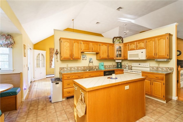 kitchen with visible vents, a sink, a kitchen island, white appliances, and tile counters